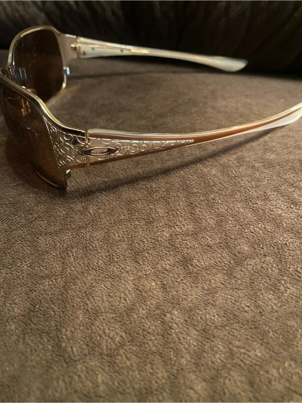 Oakley Silver Frame Sunglasses with Brown Lenses